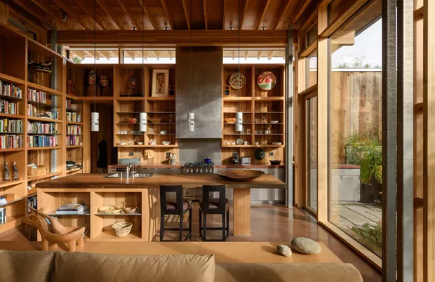 Warm wood Pacific Northwest interior with built-in shelving and natural light